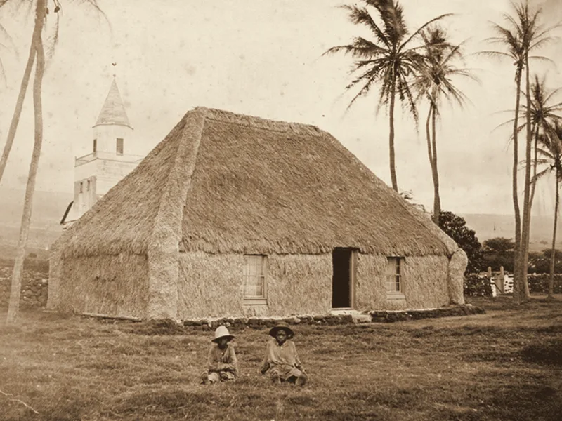 A hale pili (grass house), Kailua-Kona, about 1883. Public domain.