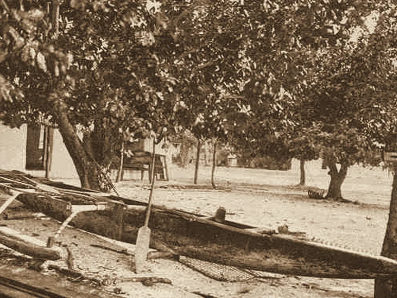 An outrigger canoe on the shore at Funafuti, Tuvalu, about 1900. Public domain.